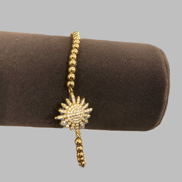 SMALL GLD STARBURST CHARM BRCT-BRACELET