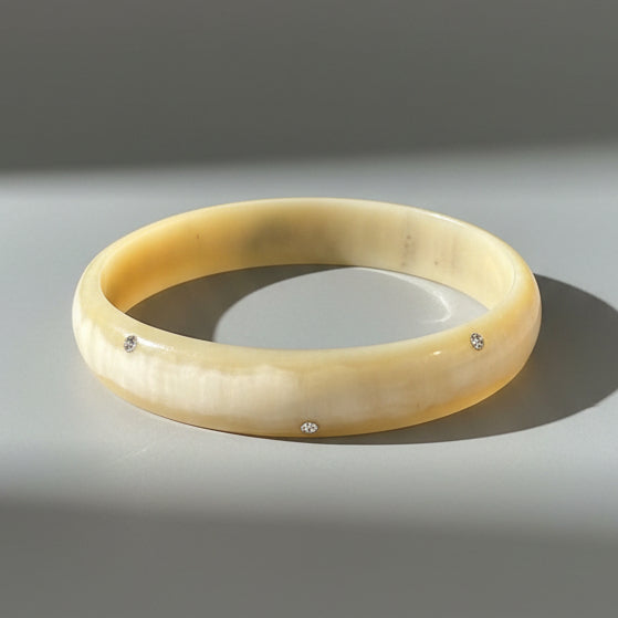 SCATTERED SWAROVSKI HORN BANGLE