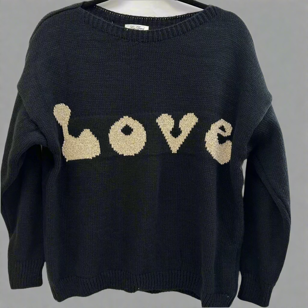 Black metallic knit sweater with the word 'LOVE' written in white on the chest area.