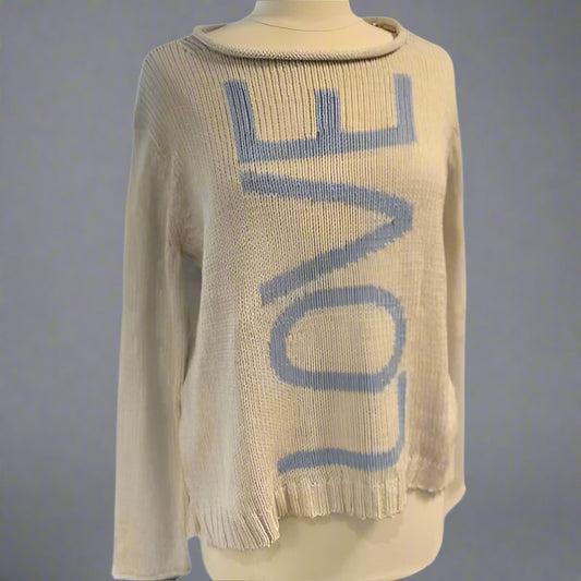 A beige and blue crew neck sweater with the word 'LOVE' knitted on the front.