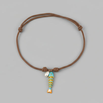 CORDED PEARL FISH NECKLACE