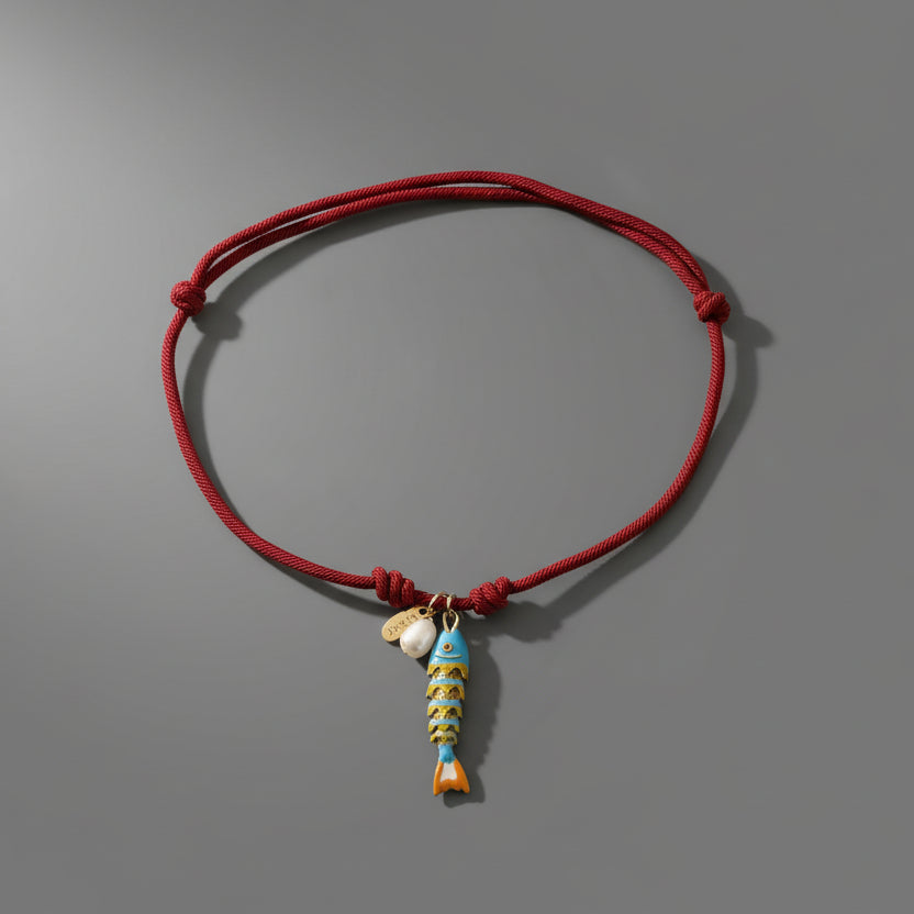 CORDED PEARL FISH NECKLACE