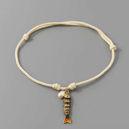 CORDED PEARL FISH NECKLACE