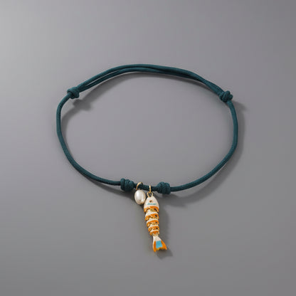 CORDED PEARL FISH NECKLACE
