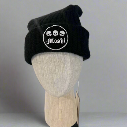 Black beanie with 'Moshi' logo on a mannequin head in a store setting