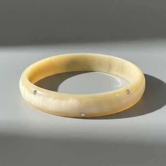 SCATTERED SWAROVSKI HORN BANGLE