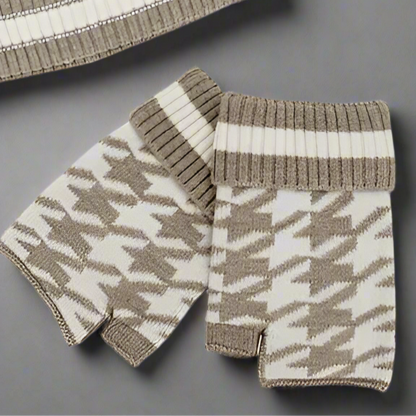 Pair of knitted fingerless gloves with a houndstooth pattern on a white background