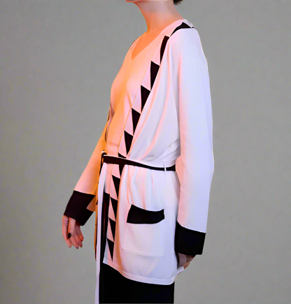 side of woman in a cardigan on a white background