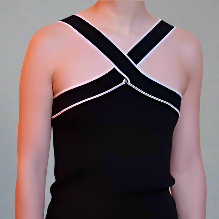 Black tank top with criss-cross straps on a white background