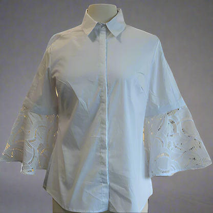 White blouse with lace sleeves on a mannequin against a white background