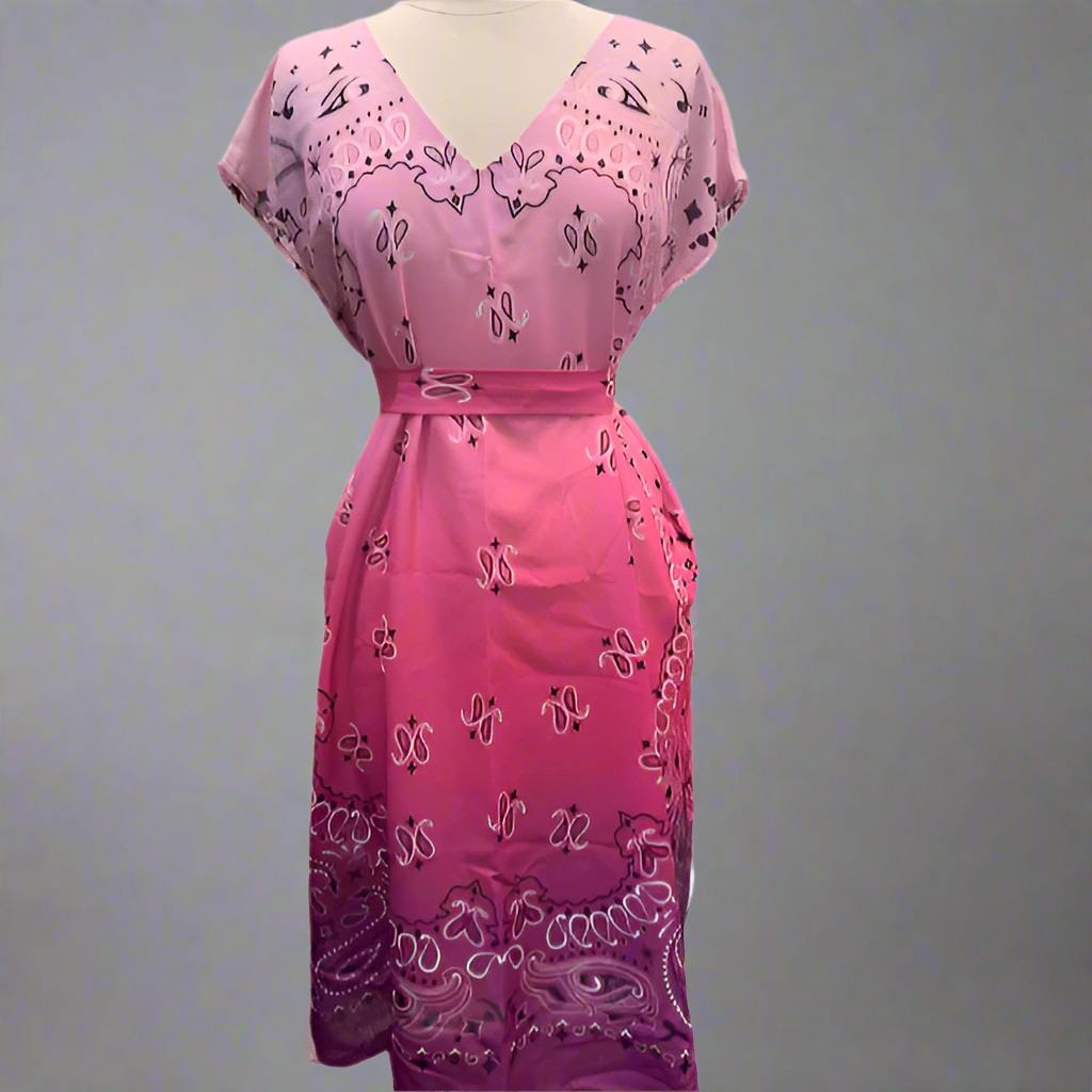 Pink dress with black paisley pattern on a white background