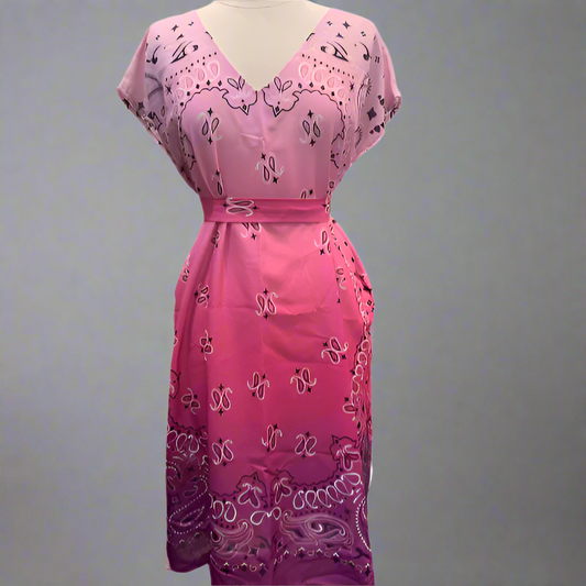 Pink dress with black paisley pattern on a white background