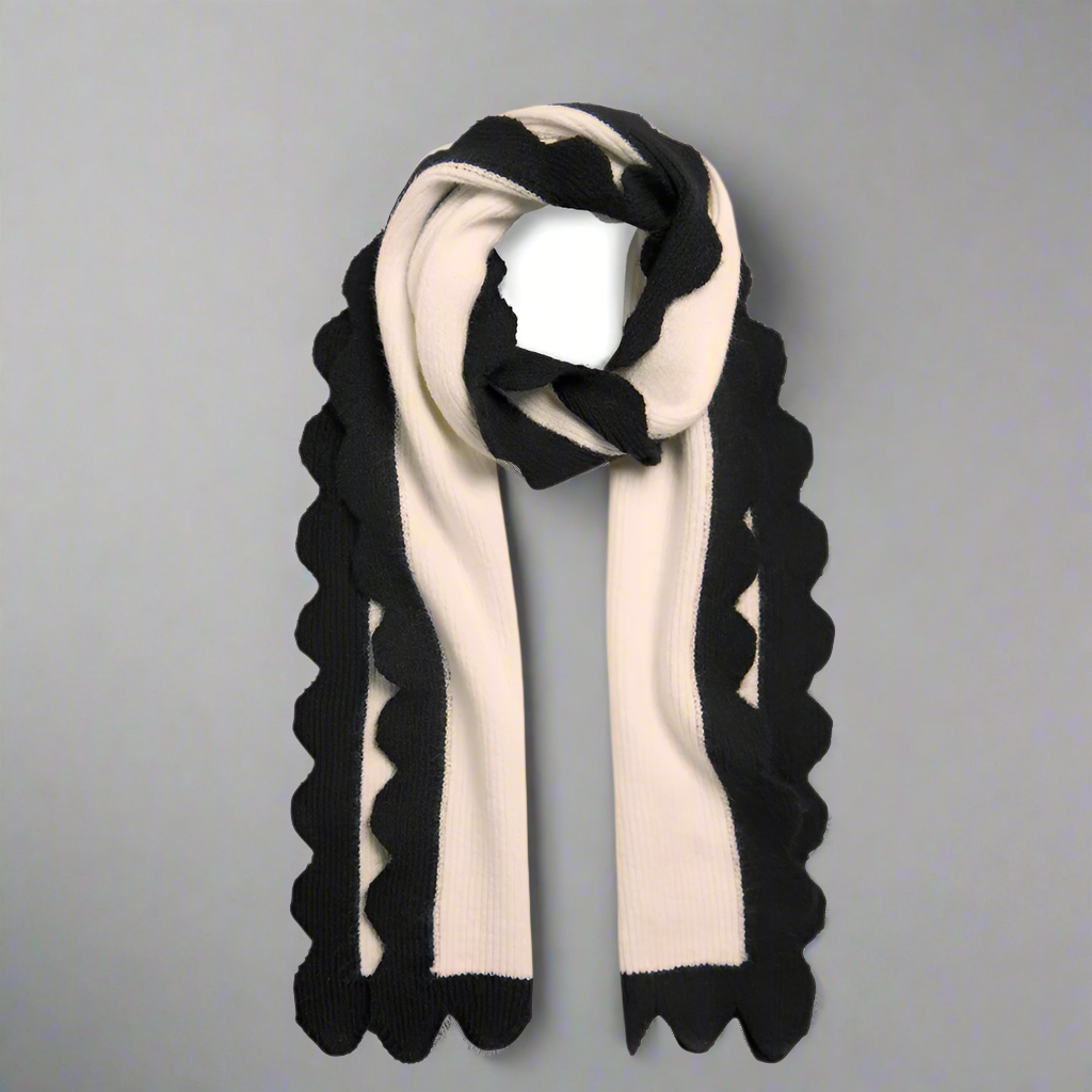 Black and white scarf with scalloped edges on a white background