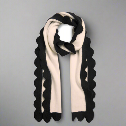 Black and white scarf with scalloped edges on a white background