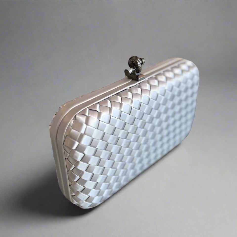WOVEN PATTERN CLUTCH WITH KNOT LOCK