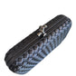 WOVEN PATTERN CLUTCH WITH KNOT LOCK