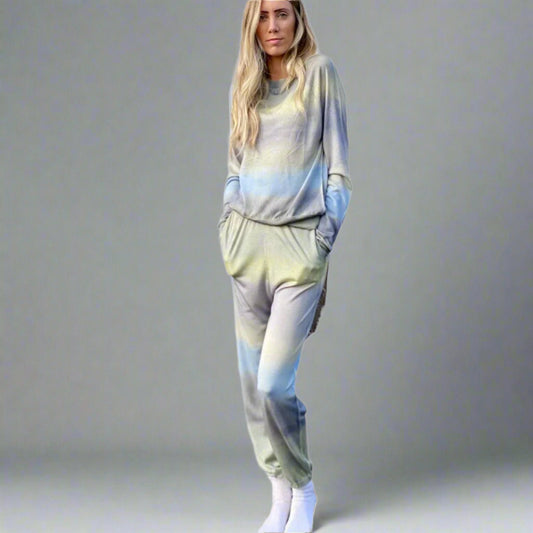 Woman wearing a tie-dye outfit on a white background