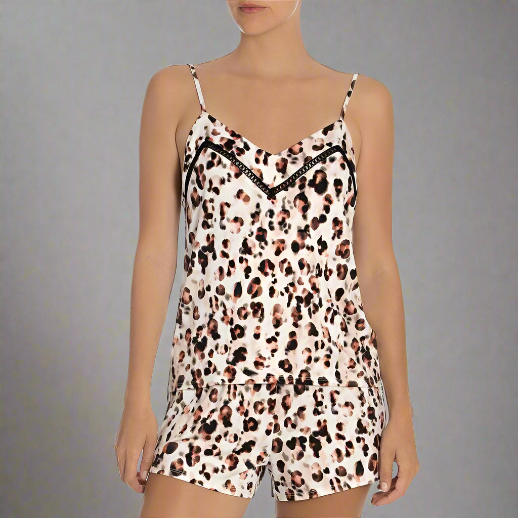 A short pajama set with leopard print design, featuring a V-neck top and elasticized waistband shorts.